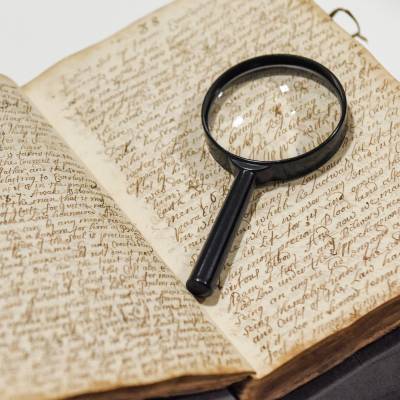Magnifying glass on handwritten diary from the University of Aberdeen's archive